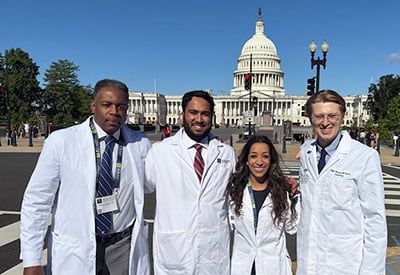 Four medical center radiologists physicians stand in front of the u. S. Capitol during the acr annual meeting advocacy event.