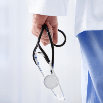 Cropped photo of doctor carrying stethoscope, representing interventional radiology services