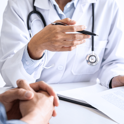 Cropped photo of a doctor talking to a patient, representing first visit to a radiologist