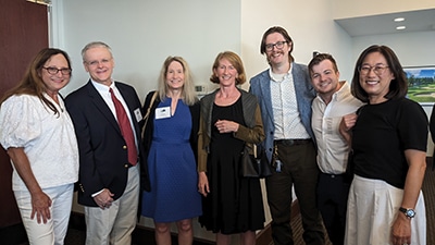 Group photo of medical center radiologists and evms representatives smiling together at the img-vrs conference.
