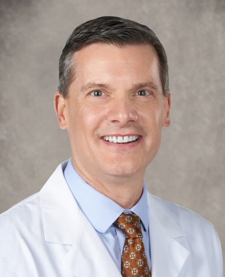 Dr. Jason yewell dressed professionally and smiling in a professional headshot.