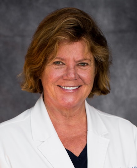 Nina fabiszewski, md. Professional headshot of a female health professional against a professional grey backdrop.