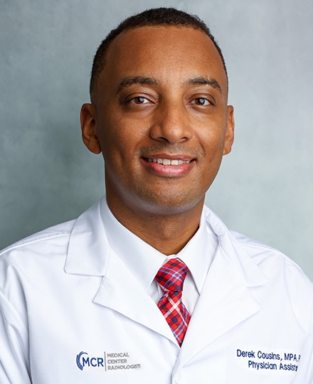 Derek cousins. Professional headshot of a medical provider wearing a white coat and patterned tie against a neutral gray background.
