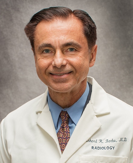 Richard barbu, md. Professional headshot of a male radiologist wearing a white medical coat.